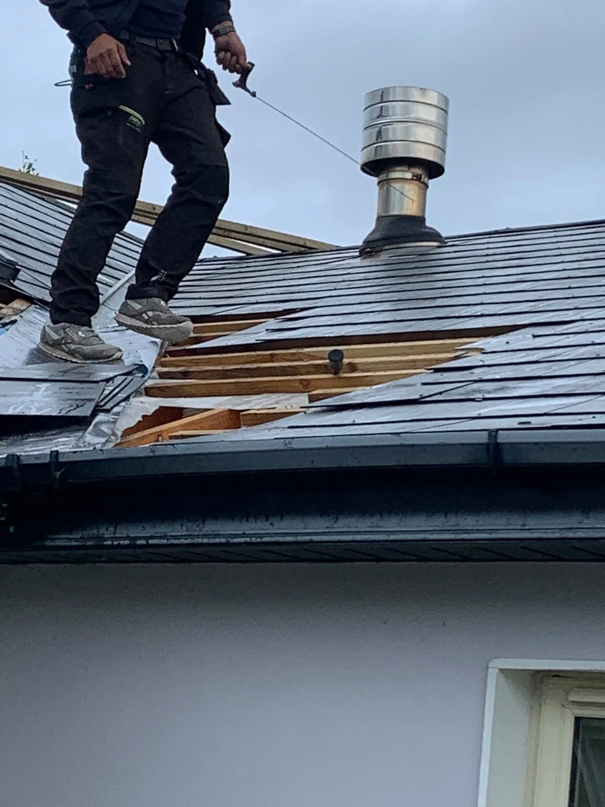 Pro Fix Roofing working on a slate roof